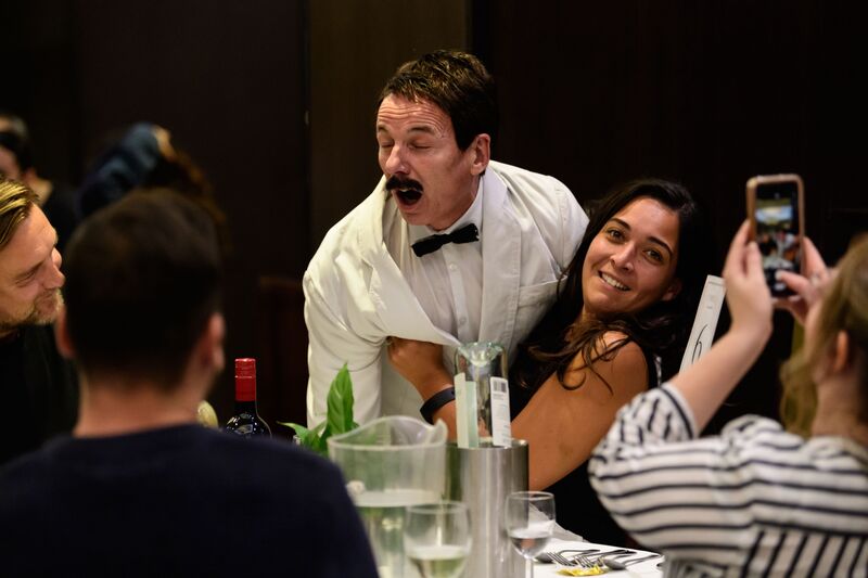 Manuel shouting around dinner guests