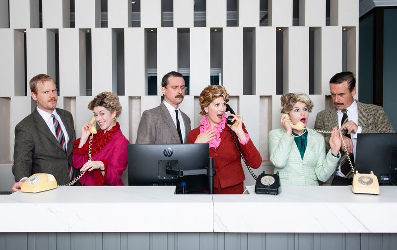 Faulty Towers Cast at Reception Desk
