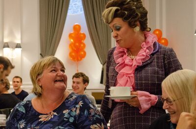 sybil chatting to a customer