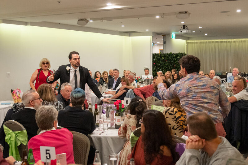 Groom shouting across a room full of people